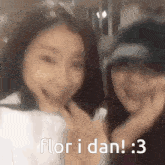 two girls are posing for a picture and the caption says flori dan