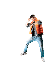 a man in an orange vest and jeans is dancing