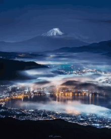 a photo of a city with a mountain in the background taken by @ill_photo_