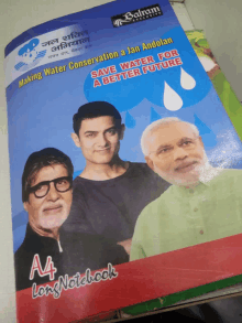 an a4 long notebook with a picture of amitabh bachchan and narendra modi on the cover