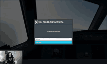 a man is sitting in front of a computer screen that says you failed the activity