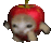 a pixel art of a cat wearing a red apple on its head .