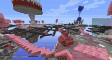 a screenshot of a minecraft game shows a tower with a cake in the background