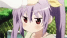 a close up of a purple haired anime girl with red eyes making a funny face .