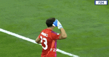 a man wearing a red jersey with the number 23 on it