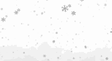 snowflakes are falling on a white background in slow motion