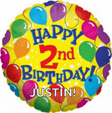 a yellow balloon with balloons and the words happy 2nd birthday justin