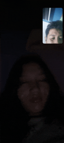 a man and a woman are talking on a video call