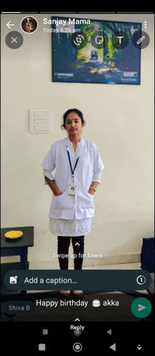 a woman in a lab coat is standing in front of a wall with a picture of a forest on it