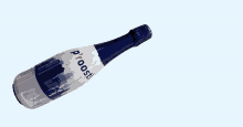 a blue and white bottle of prosecco is against a blue background