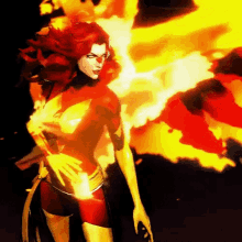 a female superhero with red hair is surrounded by fire