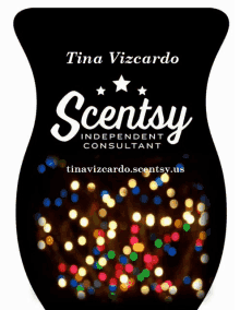 a bottle of scentsy by tina vizcardo with christmas lights in the background