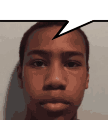 a boy 's face with a speech bubble above it