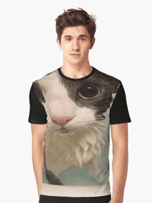 a man is wearing a black t-shirt with a cat 's face on it