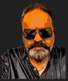 a man with a beard and sunglasses on his face .