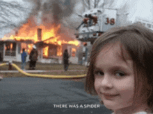 a little girl stands in front of a burning house with the words there was a spider on the bottom