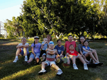 a group of children are posing for a picture and one of them is wearing a shirt that says ' texas ' on it