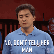 a man wearing a blue shirt that says no don 't tell her man