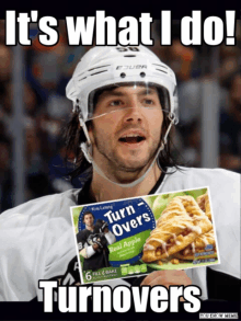 a hockey player is holding a box of turn overs real apple