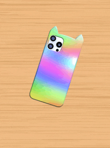 a rainbow phone case with a cat ear on the back