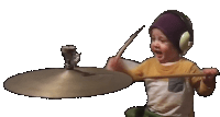 a young boy wearing headphones is playing a cymbal