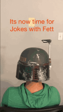 a man wearing a boba fett helmet on his head with the words " its now time for jokes with fett " above him