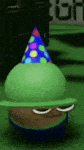 a cartoon character wearing a party hat is standing on a green carpet .