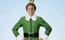 a man dressed in a green elf costume