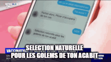 a person is holding a cell phone that says selection naturelle on it