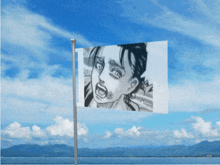 a flag with a picture of a girl screaming on it