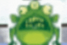 a blurred image of a green frog with three eyes .