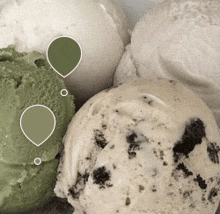 a close up of three different flavors of ice cream .