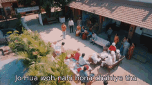 an aerial view of a group of people sitting around a table with jo hua wah nahi hona chahiye tha written on the bottom