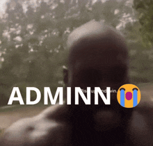 a blurred image of a man with the word adminn written above him