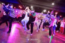 a group of people are dancing in a dance studio called tapaha the dance space