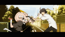 a boy and a girl are fighting on a sidewalk