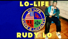 a man is sitting in front of a logo that says lo-life and rudy lo