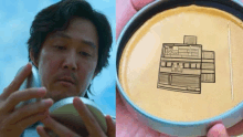 a man is holding a bowl next to a drawing of a house