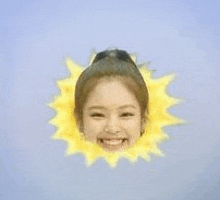 a woman 's face is surrounded by a sun .