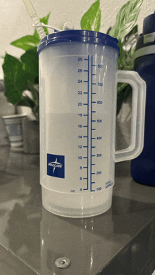 a measuring cup with the word medline on the side