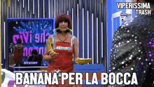 a woman in a red dress is holding a banana with the words banana per la bocca on the bottom