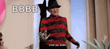 a nightmare on elm street character holding a knife and saying love ya babe