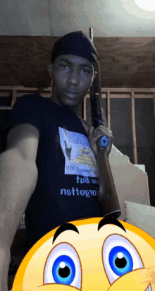 a man is holding a gun and wearing a shirt that says ' tds on nstlogo '