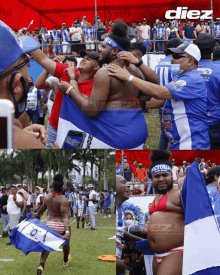 a man in a bikini holds a flag that says diez on it