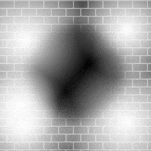 a brick wall with a circle in the middle