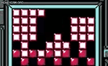 a tetris game is being played on a computer screen with a black background .