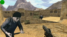 a man holding a gun in a video game with a green circle in the middle of the screen