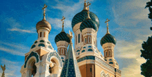 a large russian church with three domes and crosses