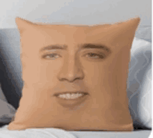 a pillow with a picture of a man 's face on it .