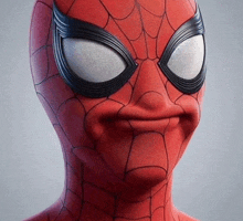 a close up of a spider man 's face with a spider web on his face .